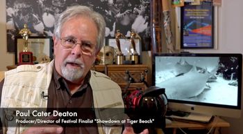An Official Selection at over 20 film festivals and winner at six of them, Paul's "Showdown at Tiger Beach" was a finalist in the Gulf Coast Film and Video Festival 2021. He is shown here giving a video introduction. Andach Mischela Photo
