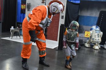 The Force is strong with this one! As his X-Wing Pilot "Lazer Brain" character, PCD encourages a young "Boba Fett" at the 2022 Houston Comicpalooza. Melissa King Photo
