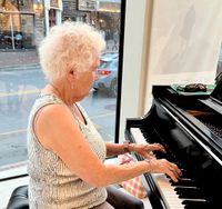 Marilynn Seits plays Christmas music for the residents of Arbor Terrace. 