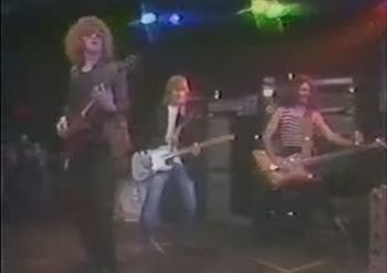 Ian Hunter (Mott The Hoople), Mick Ronson (David Bowie's Guitarist) & Dave Angel on Bass

