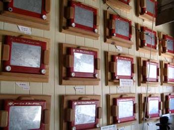 Etch A Sketch wall at the shop, waiting for an earthquake
