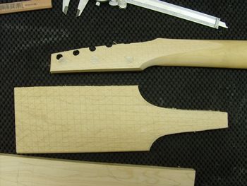 New maple is being added to the headstock so that the original shape can be restored.....
