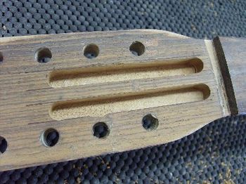 12-string headstocks sustain high string tension, so this repair will have to be reinforced with splints.
