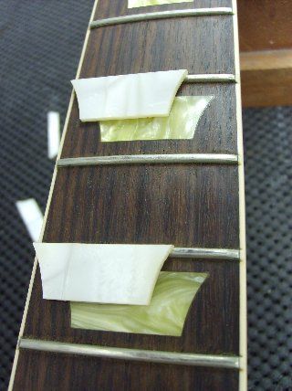 These new inlays are from Historic Makeovers, and better represent the look of the '50's Les Paul inlays.
