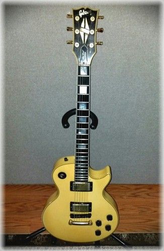 78 Gibson Les Paul Custom, I've had it a long time and probably played it more live then any other. It plays great and sounds amazing. It was White when it was new, and has faded into this "yellowish" color over the years
