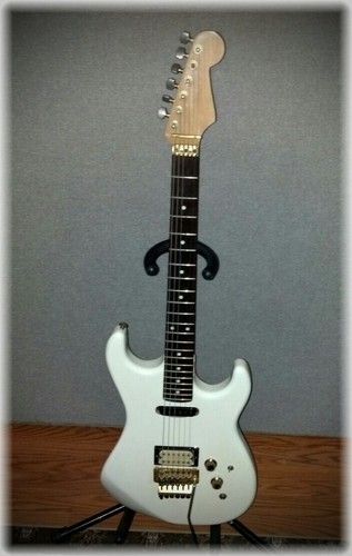 This was a Kramer Pacer I used in the 80's the only thing still "Pacer" is the body. It has a "Performance Guitar" neck and an old Floyd Rose, it plays perfect it is solid and I don't use it much anymore, but am glad I still have it. This Guitar was my most played in the 80's. Funny looking at it now the White"Snowflake" paint job was perfect for the "80's"
