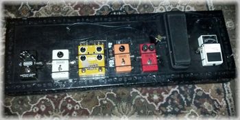 My current pedal board, I say current because both the effects and the board change every so often. The order is Guitar into Boss TU-3 tuner, Crybaby Classic Wah, MXR Dyna Comp, MXR Phase 90, T-REX Yellow Drive, MXR Micro Amp and MXR Carbon Copy Delay. If I'm using a two amp setup then I would also have a Whirlwind A-B Selecter
