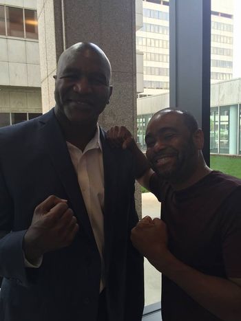 DJ Tron with Evander Holyfield
