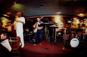 Lime St Cafe, year unknown. Kevin Hart, piano; me, guitar; Kevin Ellis, bass; unknown, drums; Virgil Rhodes sitting in on saxophone. Childhood friend James Isley took this picture, for what it;s worth.

