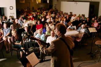 Motivational Humorist Greg Tamblyn performing for large audience