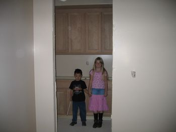 Hall linen closet with my grandkids Taylor on the right 8 years old Koii on left 5 years old.
