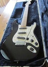 1995 Fender Stratocaster (Mex) in gloss black with white pearl pick guard
