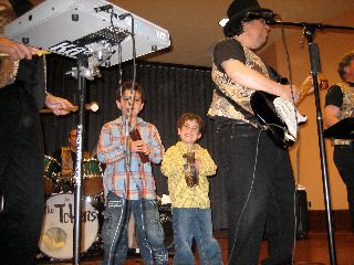 Token Grandkids Solomon and Jax beef up the rhythm section.

