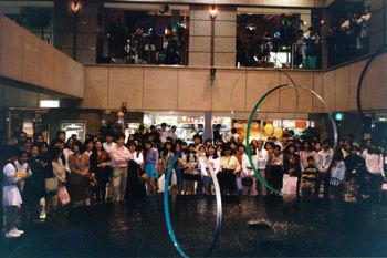 Indoor mall gig audience.
