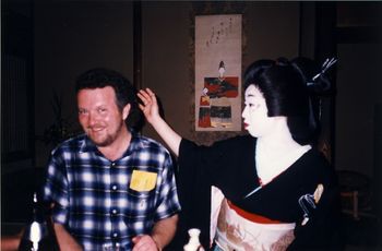 With a Maiko, ('Maiko' means 'Geisha in training.')
