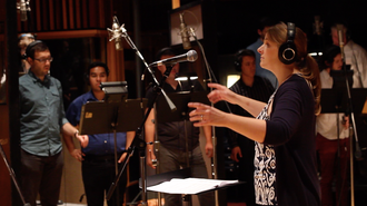Composer/Orchestrator Sandra Schnieders conducting choir at EastWest Studios for KALADIN