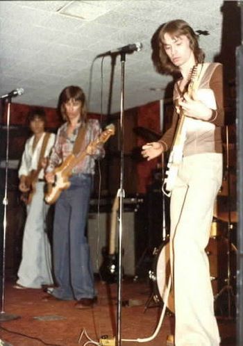 Jeff plays a Fender strat through a Sunn Model T amp as John plays his Precision Bass through a Sunn Bass head w/folded horn bottom at Shoes' first gig at the Brat Stop in Kenosha, WI in April of 1976.
