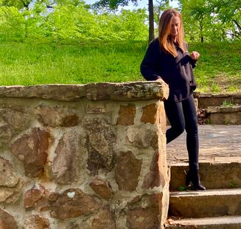 Kat, demonstrating how to descend stairs (or maybe how to walk up them backward)
