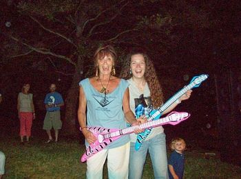 Rockin' out with Pat in the Hat on inflatable guitars... she SOOO kicks my ass on blow up instruments. You are the master Pat!
