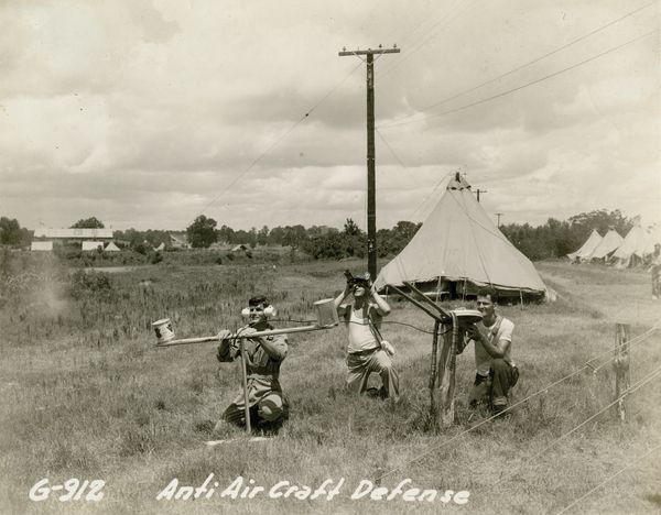 Anti-aircraft defense training exercises use soup cans and sticks as
equipment because of shortages, Natchitoches, 1940.
Gift in Memory of John O. Spinks, Sr., 2011.018.001