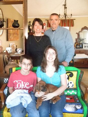 The Ferretti Family, from Texas, with Riley, their Ra/Emerald puppy.
