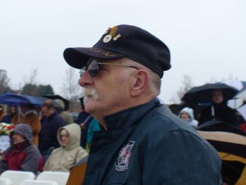 Many veterans such as he stood and braved the elements.
