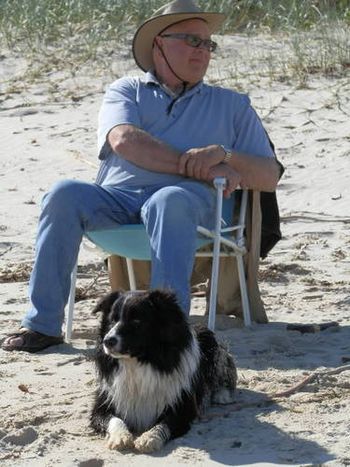 Jasper on the beach with his human grandfather.
