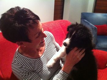 Sassie getting a cuddle from her new owner Lee. Sassie is so lucky to be living on the Gold Coast.
