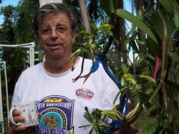 We also grow and cure Vanilla right here. This is Jeff early in the morning walking the Vanilla Shade house. (counting his beans!)
