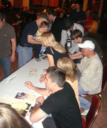 Everyone signing the CDs we gave away after the show in Venice!
