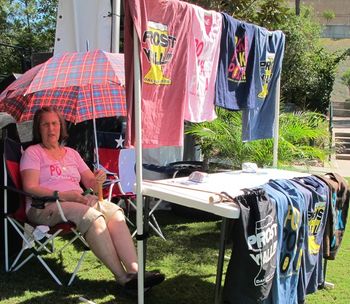 Mom selling t-shirts on a hot day in the Woodlands
