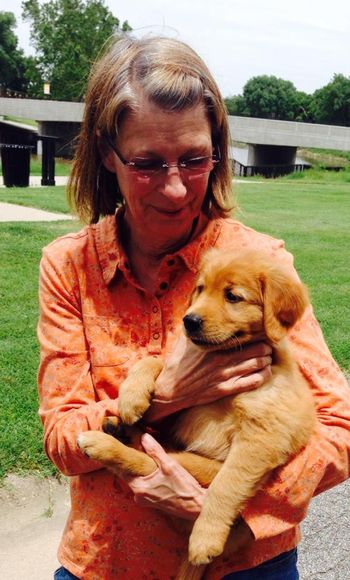 Marilyn Scheffler picking up Nordie (green boy)
