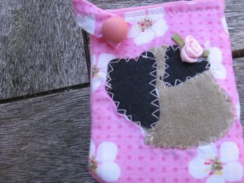 detail, pink cell cozy with flower head fawn girl
