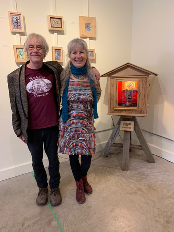 Lewis and Tannis beside the Curiosity Cabinet
