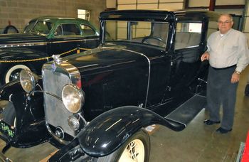 Ruben with 2 of his old cars
