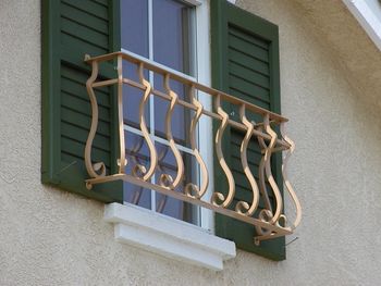 Decorative iron window enhancement over nonfunctioning window.
