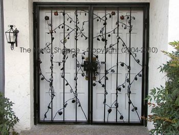 Custom Forged and Fabricated Double Security Door with Copper Rose Vines/Buds / Location: Fresno, CA Collaboration with A Copper Rose Metal Art
