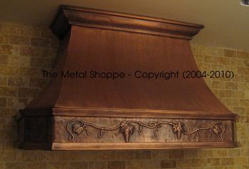 French Curve Welded Copper Hood with Welded Copper Molding and Custom Repousse Grape Motif Location: Sanger, CA
