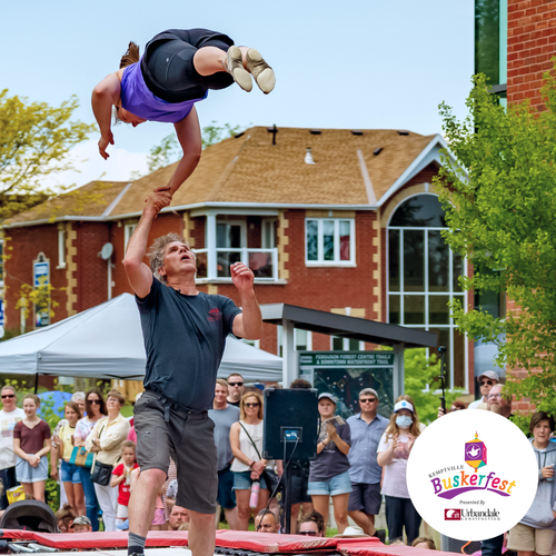 Two buskers on a trampoline surrounded by an incredible crowd in Kemptville