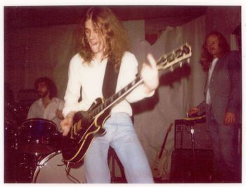 Daveplaying a black Les Paul at a gig, circa 1976.
