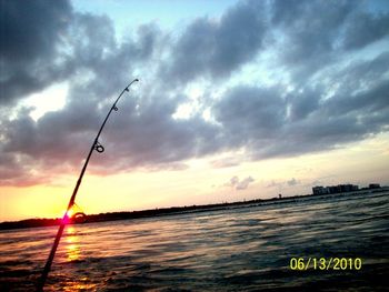 Mazz fishing at the Ft Pierce Inlet. This view isfrom theFar end of the Inlet on the Jetty Rocks during sundown. June 13th, 2010
