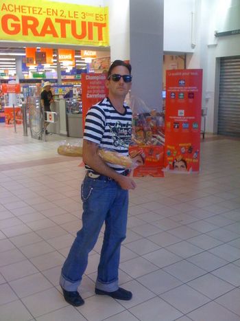 Buzz going for his "French-look" with striped shirt and bread.
