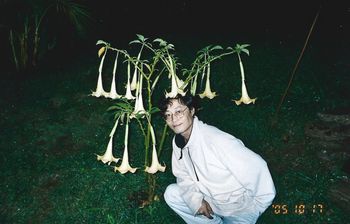 Bobby Moon with a Datura plant @ the Tripsville Studio garden, where various psychotropic plants, herbs and mushrooms grow! This garden was the inspiration behind the song "Homegrown Gnome" from Pablo's 2011 masterpiece album 'Fully Baked'.
