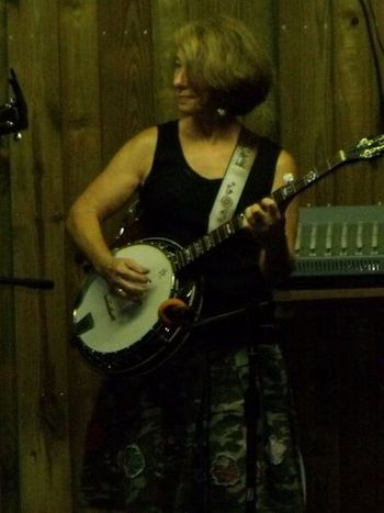 September 2009. Alyse doing some pickin' with Flatt Tyred at a North Carolina farm party. With family roots in Alabama and Virginia, she grew up loving the bluegrass sound.

