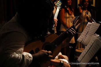 Bryan Vargas playing cuatro at Old San Juan CD release party. 10-16-10. Photo by Josué Guarionex.
