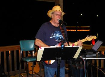 Friday night 9-7-2012 on the deck at The Pond House in Metter, GA. This photo was not intended as a political statement because of the empty chair onstage behind me. :o) It just turned out that way.....so here is to Clint.
