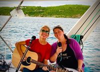 Lauren and Kerrin sing some harmonies on a sunset sail