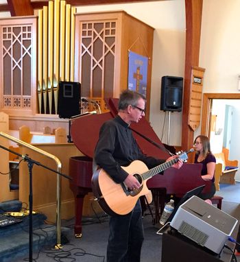 Rev. John Watton and Lesley lead the congregation in the opening worship songs. St. Martin's Cathedral, Gander, NL.
