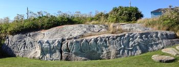 William E. deGarthe carved this “lasting monument to Nova Scotian fishermen” on a 30-metre (100-feet) long granite outcropping situated behind his house. The figures were each inspired by local people. A truly epic work of art!
