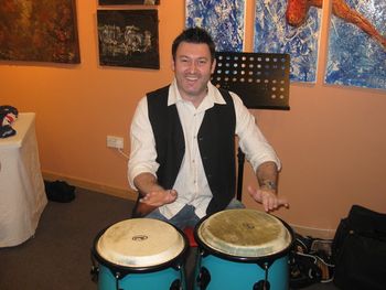 Playing congas at the press conference for the 'Wish-Magic Tour'
